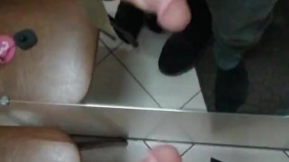 Guy fingering his big dick in the locker room close-up