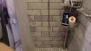 Caged slave drinks his own piss in the shower at Sir's request