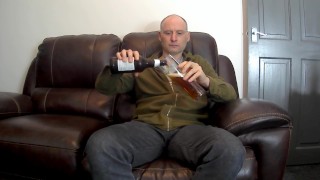 Kudoslong strips and masturbates till he cums with a beer bottle up his anus
