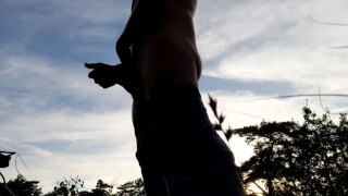 hot guy with perfect cock masturbates in beautiful public sundown scenery