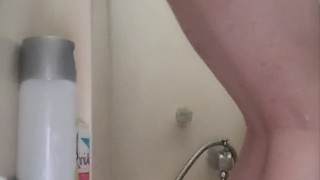Rosie pleasures herself in the shower while husband is away