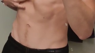 fit twink showing off in the mirror