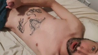 Bearded tattooed guy wanking