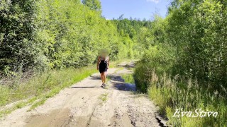sexy blonde pissing in a puddle on the road
