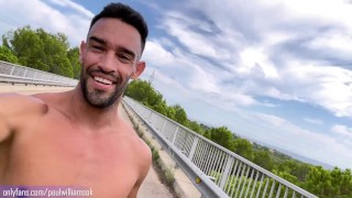 Fit guy gets naked next to a highway on a bridge. Very Risky!