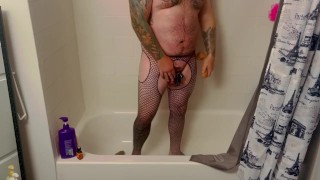Caged fag bou plays with toys in the shower 
