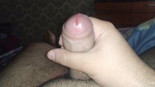 Hairy bear plays with his uncut morning wood and balls