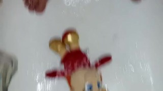 In the Shower Playing with a Plush Elf