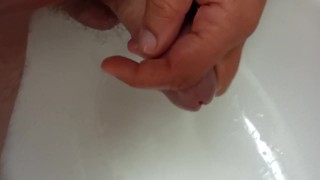 playing with peephole while I'm pissing 