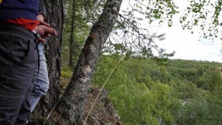 Two tight streams of urine cross in the mountains. Pissing outdoor UHD 4K video