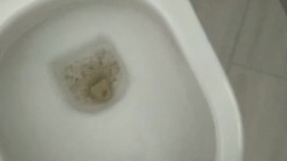 A beautiful pee in a public toilet with hard cook