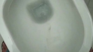 A beautiful pee in a public toilet with hard cook
