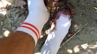 Outdoor food fruit crush with white socked feet