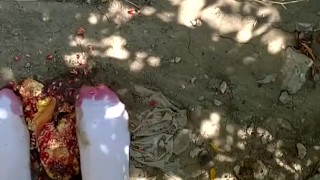 Outdoor food fruit crush with white socked feet