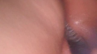 Young latina playing on snapchat