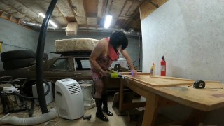 Big fake tits crossdresser in pink drees fishnets and heels doing wood work