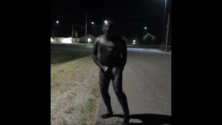 doubled cocked masked wetsuited guy jerking off outside