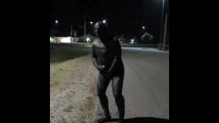 doubled cocked masked wetsuited guy jerking off outside