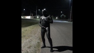 doubled cocked masked wetsuited guy jerking off outside