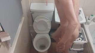 Skinny teen Having fun in bathroom pissing in toilet and putting his head inside of it