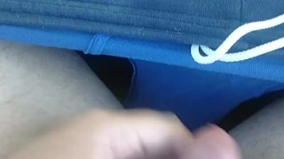 Cumming on a public park bench
