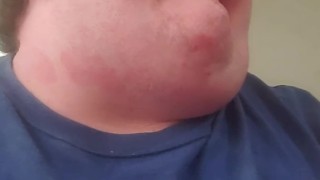 Fat male testing throat with banana
