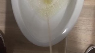 Peeing in a bathroom stall