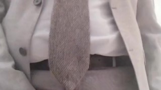 Cumshot in the office in a suit and tie