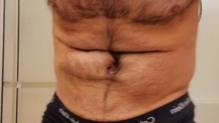 Muscle bear flexing in Calvin Klein underwear 