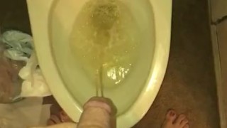 Sissy boi on night dress pees in a toilet 