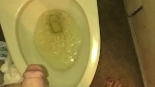 Sissy boi on night dress pees in a toilet 