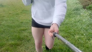 Crossdresser walks in the rain in tiny skirt