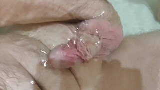 I'm caressing my weird circumcised cock and ass hole during the bath time.