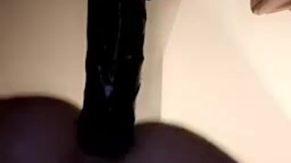 Slut fucked by black dildo doggy