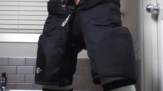 Straight hockey bro strokes his hard cock in his gear after the game