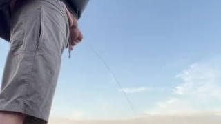 Pissing on the StLawerence river bank 