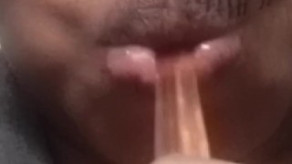 Sucking gummy worms 