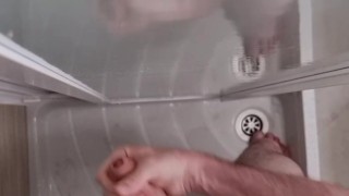 Guy jerks off and cums a big load in the shower