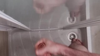 Guy jerks off and cums a big load in the shower