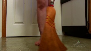 Hairy brunette Beryl Aspen strips while she cleans to show off her huge ass