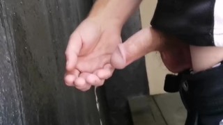 Playing with piss like hose at urinal