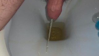 close up of my foreskin while peeing in toilet