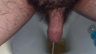 close up of my foreskin while peeing in toilet