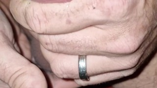 Guy enjoys jerking his cock and cums in his hands