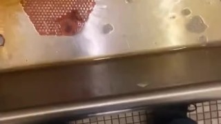 Taking a piss at an old urinal trough