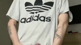 A handsome student came from training and jerks off a dick and cums right on his T-shirt