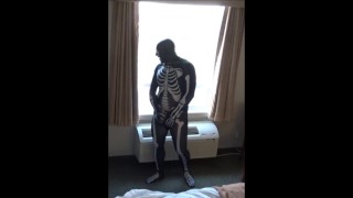 skeleton jerking off at hotel window watching truck drivers get ready for work