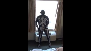 skeleton jerking off at hotel window watching truck drivers get ready for work