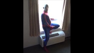 spiderman in black silicone mask jerking off at hotel window