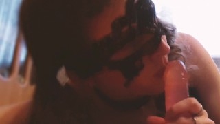 Crossdresser Abby White playing with a large Pink dildo